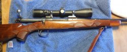customized Remington model 721 with Tiger wood fore end and custom checkering.